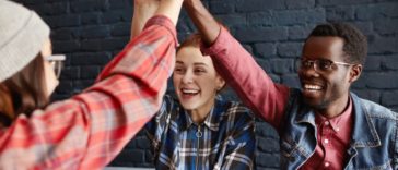 Enthusiastic, motivated team of entrepreneurs at a tech startup