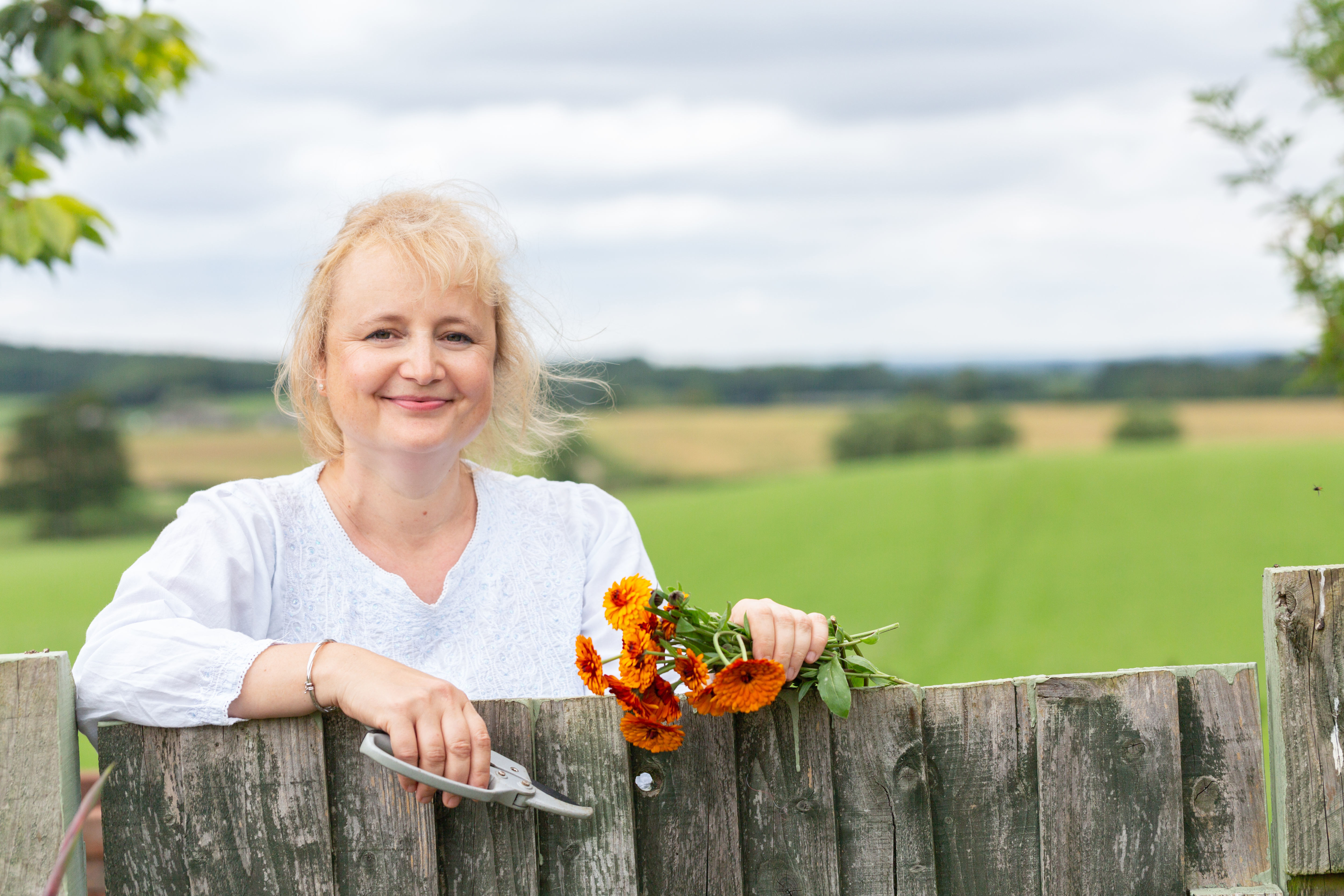 rebecca bennett behind a wodden gate