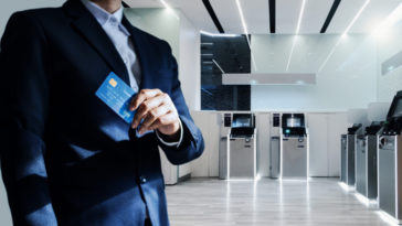 bank manager holding a credit card