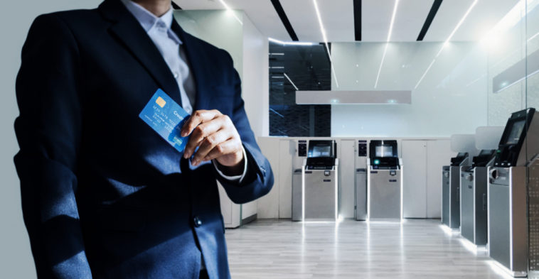 bank manager holding a credit card