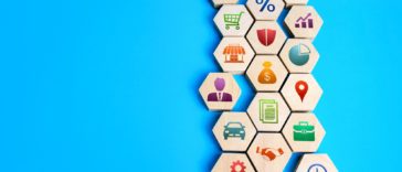 assembled structure of tiles with business concept icons on them
