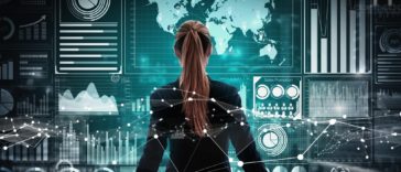 businesswoman standing in front of a holographic wall with stats and charts