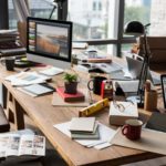 office table with business tools and material