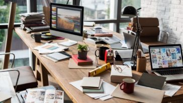 office table with business tools and material