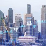 holographic stock charts with city backdrop