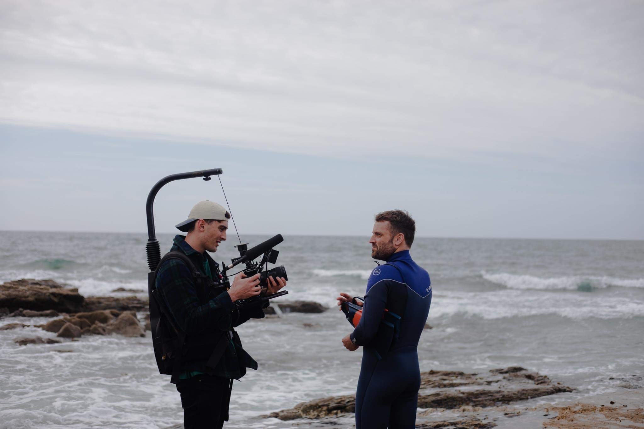 cameraman filming a man in a diving suit