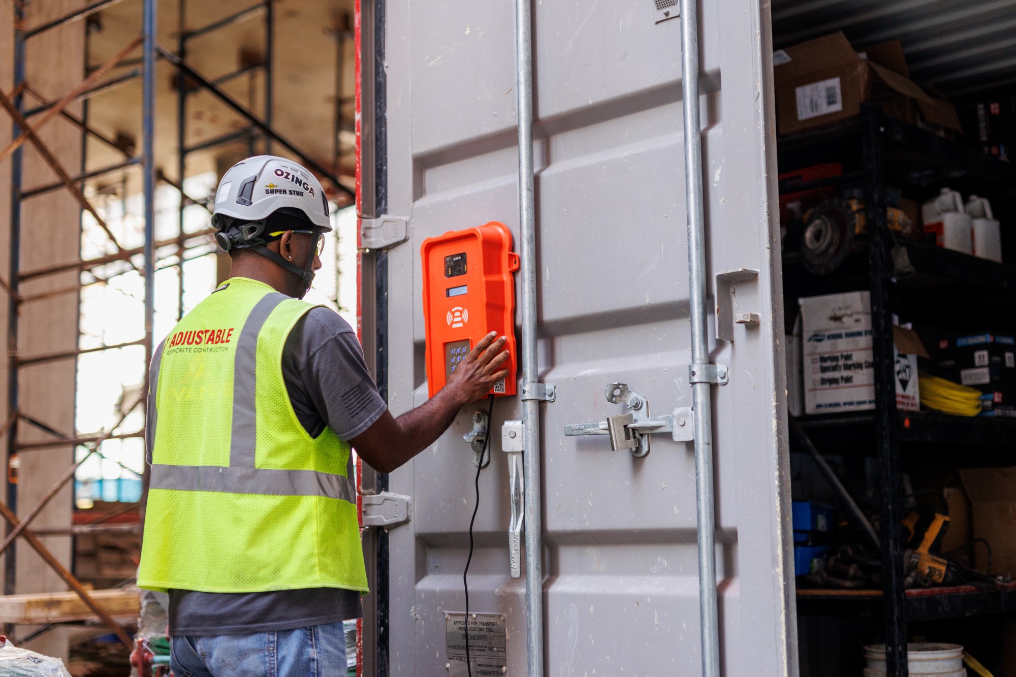 construction worker using a time tracker at work